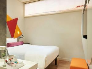 Ibis Styles Singapore On Macpherson客房内的一张或多张床位