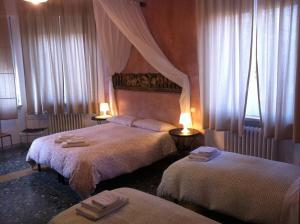 Postel nebo postele na pokoji v ubytování B&B Amerigo Vespucci
