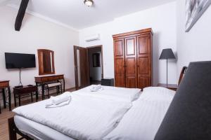 Posteľ alebo postele v izbe v ubytovaní Penzion Královské lázně