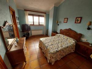 Postel nebo postele na pokoji v ubytování Casa Rural El Callejo