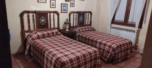 Postel nebo postele na pokoji v ubytování Casa Rural El Callejo
