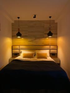 Postel nebo postele na pokoji v ubytování Hotel ULYSSES
