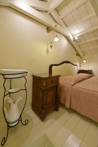 Posteľ alebo postele v izbe v ubytovaní Angelica Traditional Boutique Hotel