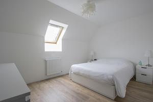 Posteľ alebo postele v izbe v ubytovaní La maison des marronniers