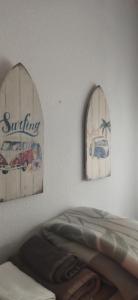 a bedroom with two window signs and a bed at Apartamento rural castril in Castril