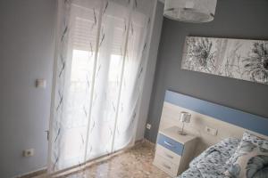 Postel nebo postele na pokoji v ubytování Elmiradordelasmurallas