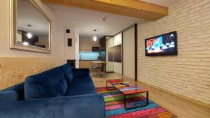 Televízia a/alebo spoločenská miestnosť v ubytovaní Apartament Widokowy 40