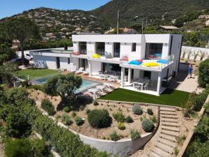 an aerial view of a house with a swimming pool at VILLA BLANCHE in Cavalaire-sur-Mer