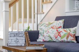 a blue couch with a box on a coffee table at Plovers Nest in Newburyport +41 photos