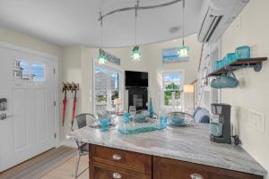 a kitchen with a large island in a room at Plovers Nest in Newburyport