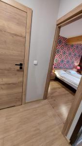 Posteľ alebo postele v izbe v ubytovaní Apartament Widokowy 40