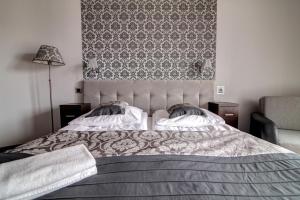 Posteľ alebo postele v izbe v ubytovaní Krynica Apartamenty Centrum Deptak 119