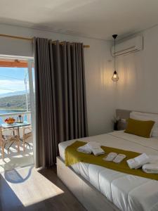 Postel nebo postele na pokoji v ubytování Relax Mea Hotel