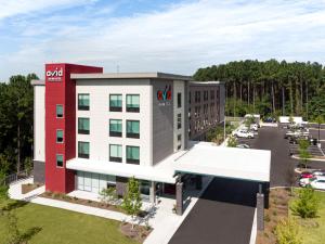 an aerial view of a hotel with a parking lot at avid hotel Summerville, an IHG Hotel in Summerville