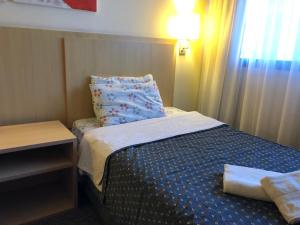 Cama o camas de una habitación en Apart-hotel Luxo