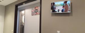 a flat screen tv hanging on a wall at Madinaty 2 in Madīnat ash Shurūq