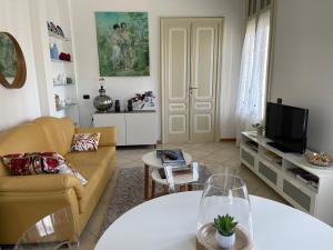 a living room with a couch and a table at My Home by Sveva in Parma