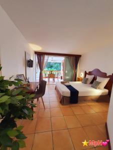 Postel nebo postele na pokoji v ubytování Mon Pti Nid - Havre cosy avec vue tropicale en Martinique