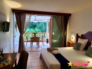 Postel nebo postele na pokoji v ubytování Mon Pti Nid - Havre cosy avec vue tropicale en Martinique + 33 fotografií