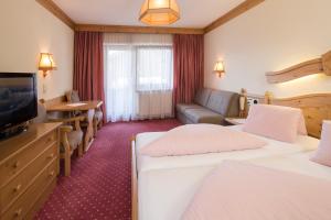 Ein Bett oder Betten in einem Zimmer der Unterkunft Hotel Jenbacherhof B&B