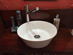 a white sink with a faucet on a counter at Pocitos Private Room in Montevideo