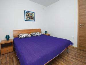 Ένα ή περισσότερα κρεβάτια σε δωμάτιο στο Apartments Grzic