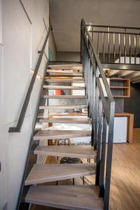 
a row of wooden stairs leading up to a staircase at MIO Apartments in Adler
