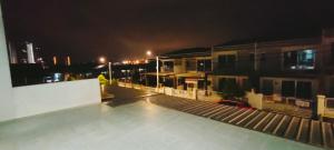 a view of a rooftop of a building at night at IPOH staycation in Ipoh