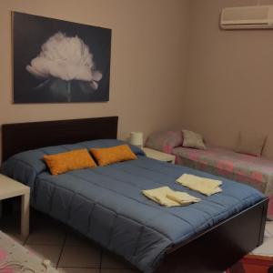 Tempat tidur dalam kamar di I capricci dell'Etna 1 di Puglisi