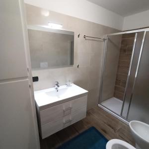 a bathroom with a sink and a shower at Alpestre Trifolium Appartamento Trilo Cervinia CIR 0427 in Breuil-Cervinia