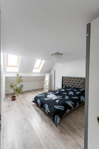 Ένα ή περισσότερα κρεβάτια σε δωμάτιο στο Enygma Penthouse
