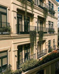 a building with plants on the side of it at La Chronique Hotel in Phnom Penh