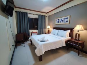Postel nebo postele na pokoji v ubytování Spring Plaza Hotel