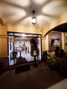 a room with a window with a table in it at Spring Plaza Hotel in Dasmariñas