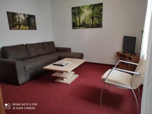 a living room with a couch and a coffee table at Bolschwitz 39 in Bolschwitz