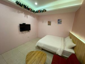 Een TV en/of entertainmentcenter bij 微笑18民宿 附車位
