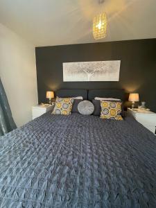 a bedroom with a large bed and two night stands at Little Haven in Dartmouth