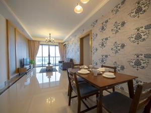 a dining room with a table and chairs at Netflix SmartTV CitySeaview & HighFloor at R&F Mall in Johor Bahru