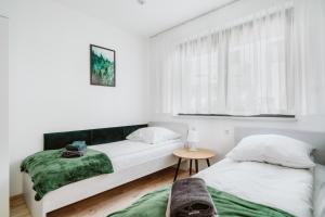 Posteľ alebo postele v izbe v ubytovaní Apartament Na Borach I SPA