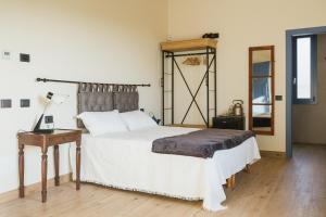 A bed or beds in a room at Corte Mira