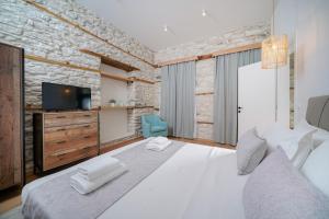 Posteľ alebo postele v izbe v ubytovaní Hibiscus Villa