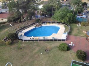 
a swimming pool with a pool table and chairs at Hotel Dr. Cesar C. Carman in Córdoba
