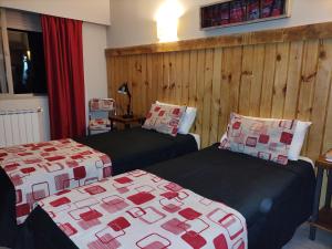 Postel nebo postele na pokoji v ubytování Hostal El Korú