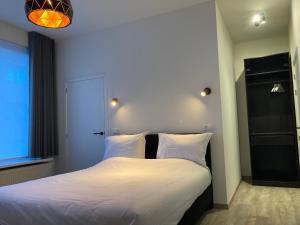 Postel nebo postele na pokoji v ubytování RS10 Turnhout