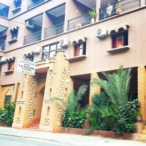 a building with a sign on the side of it at Hôtel Restaurant La Gazelle De Dades in Akhendachou nʼAït Ouffi