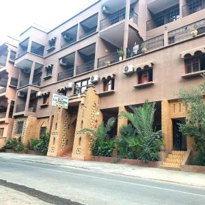 a large building with balconies on the side of it at Hôtel Restaurant La Gazelle De Dades in Akhendachou nʼAït Ouffi