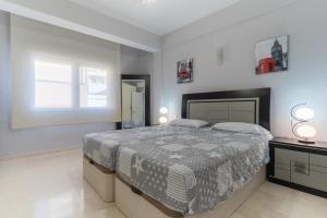 Posteľ alebo postele v izbe v ubytovaní Apartamentos Castillo