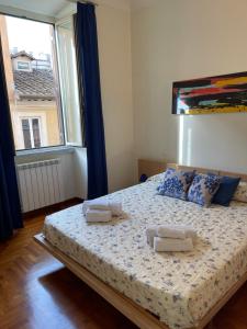 Postel nebo postele na pokoji v ubytování ColosseoDreamApartment