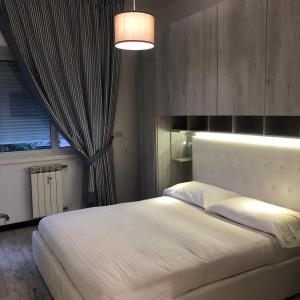 A bed or beds in a room at La Casa di Gio Golf Tennis e parcheggio privato