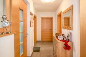 a hallway with a room with a door and a counter at Lampenhof in Brunico +4 photos